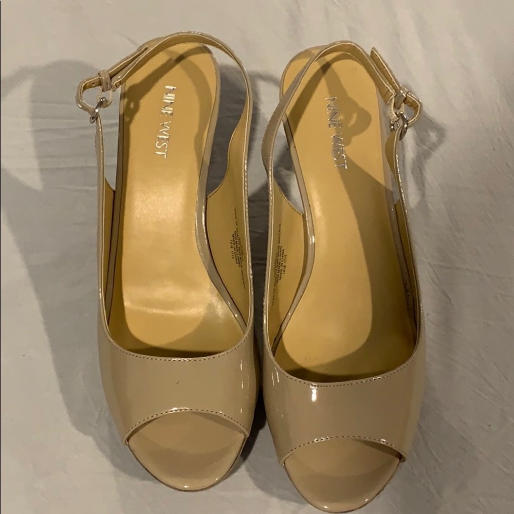 Nine West nude high heels with open toes.
